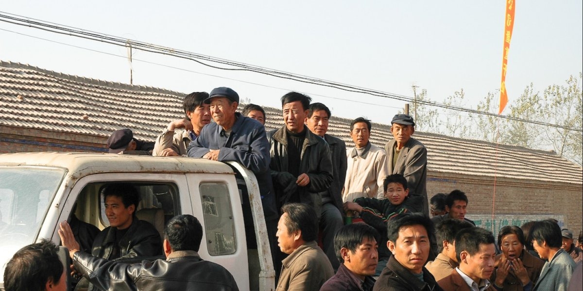 MEN COMMUTING TO WORK IN NORTHERN CHINA.
